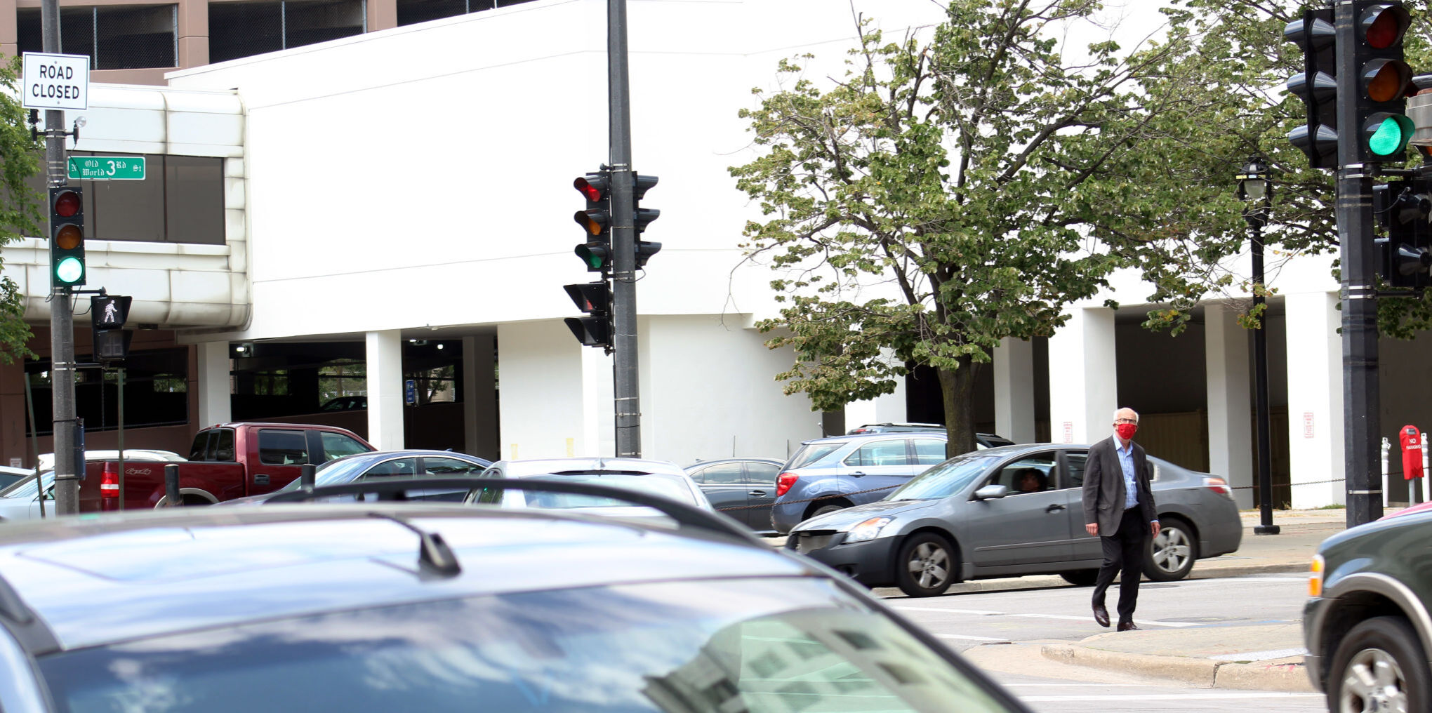A man walks along Third Street in Downtown Milwaukee